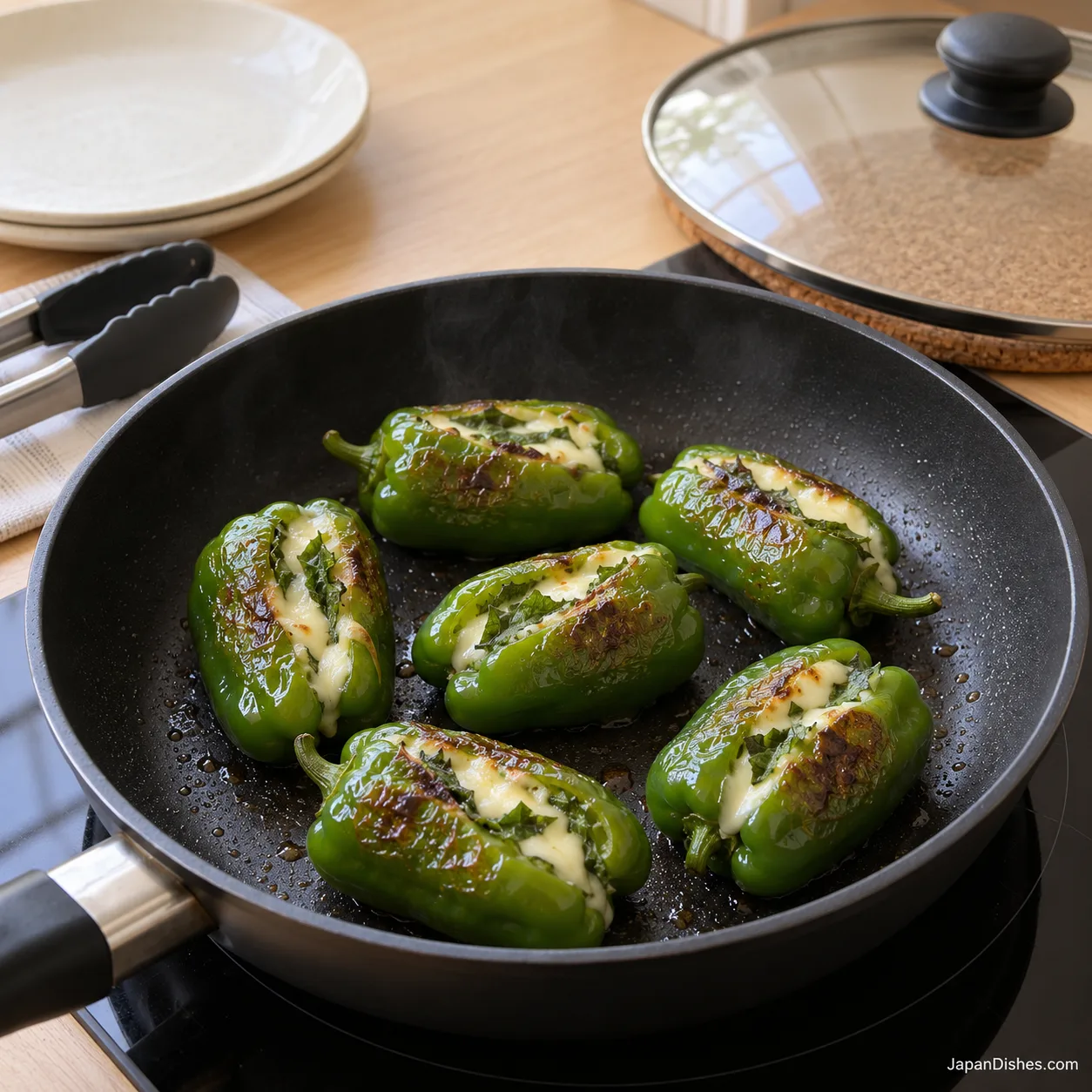 Soft blistered peppers with melted cheese after removing the lid