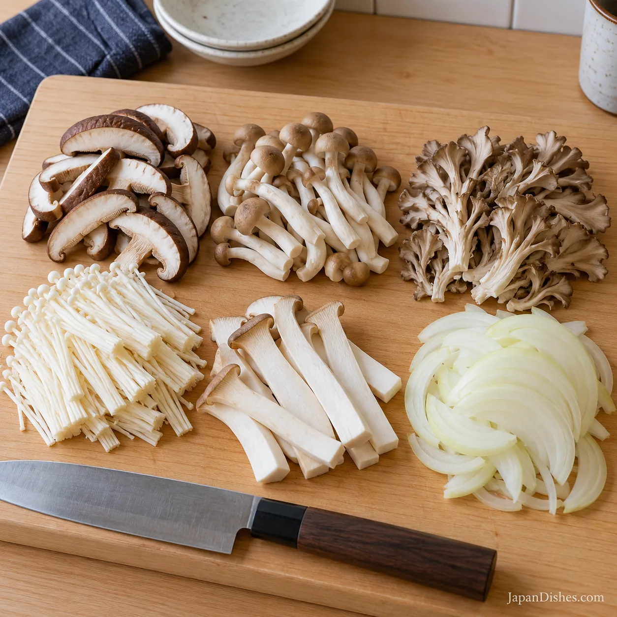 Prepared shiitake, shimeji, maitake, enoki, king oyster mushrooms and thinly sliced onion